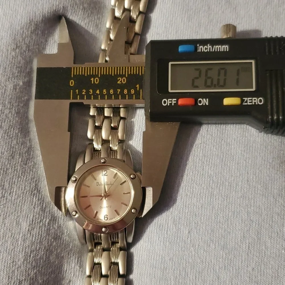 Delta Burke‎ Watch Women Silver Tone Round Studded Bezel New Battery 8½